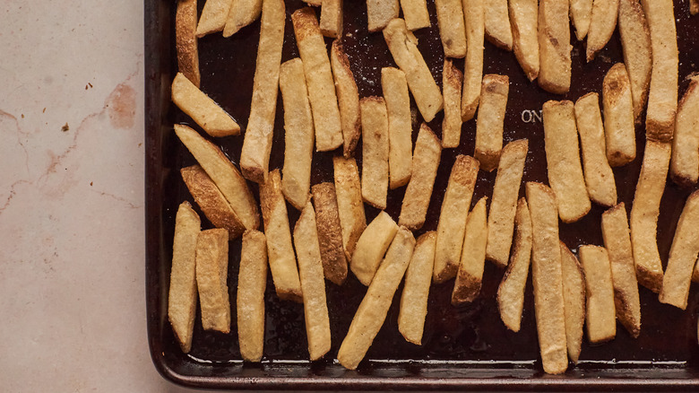 french fries on baking sheet