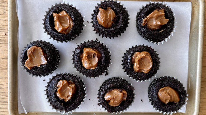 Dulce de leche-stuffed chocolate cupcakes