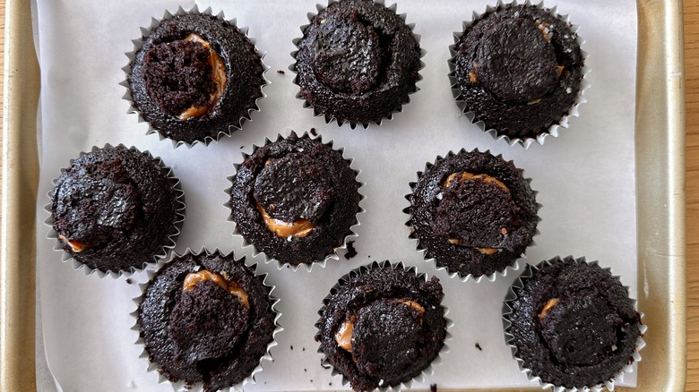 Topped dulce de leche-stuffed chocolate cupcakes