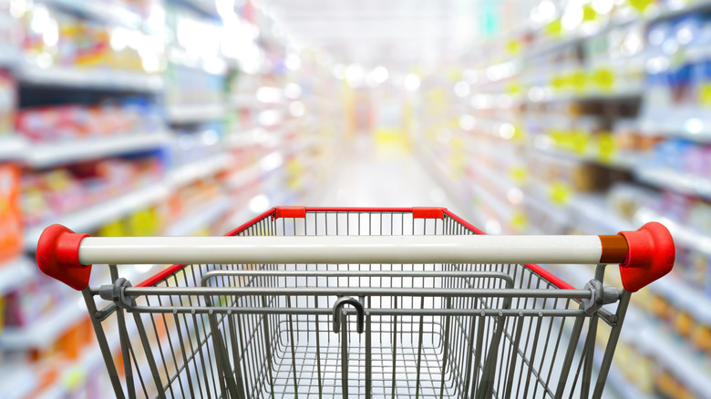 shopping cart in grocery aisle