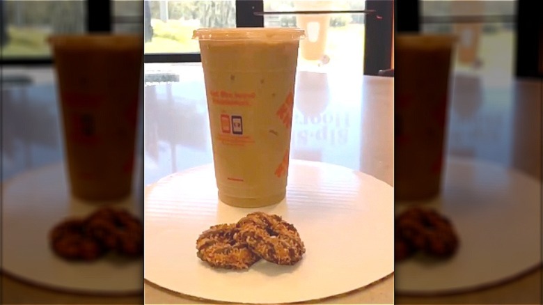 Girl scout cookies with iced coffee on table