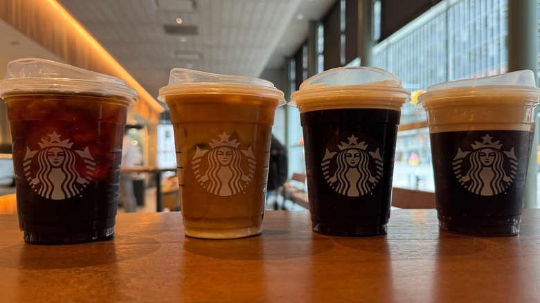 Row of plastic coffee cups