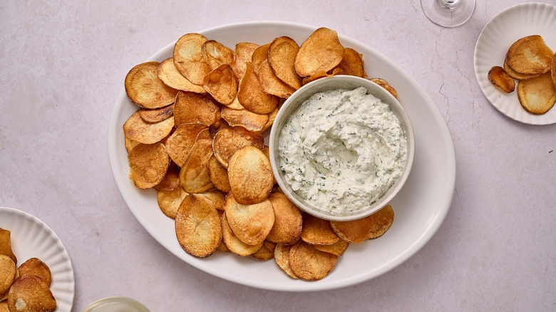 chips on a platter with onion dip