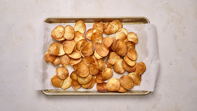 draining potato chips on paper towel