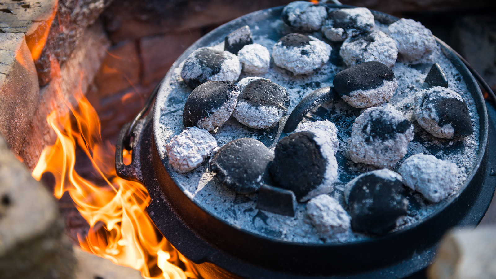 Coals on the Lid of a Dutch Oven Cooking Dinner Stock Image