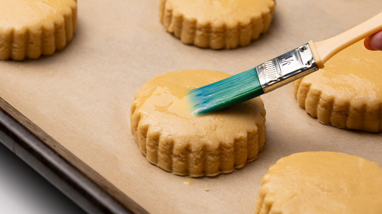 Brushing scones with egg 