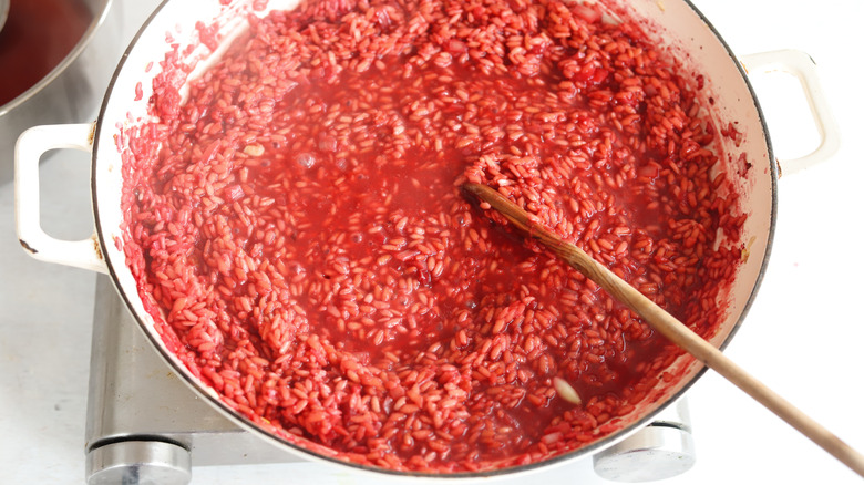 rice in a pan with red wine