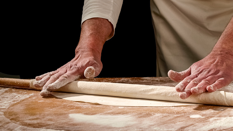 bakers rolling phyllo dough