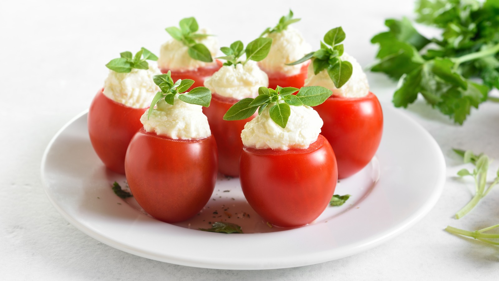 Easily Hollow Out Cherry Tomatoes With A Measuring Spoon