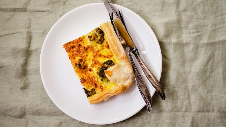 slice of quiche on plate