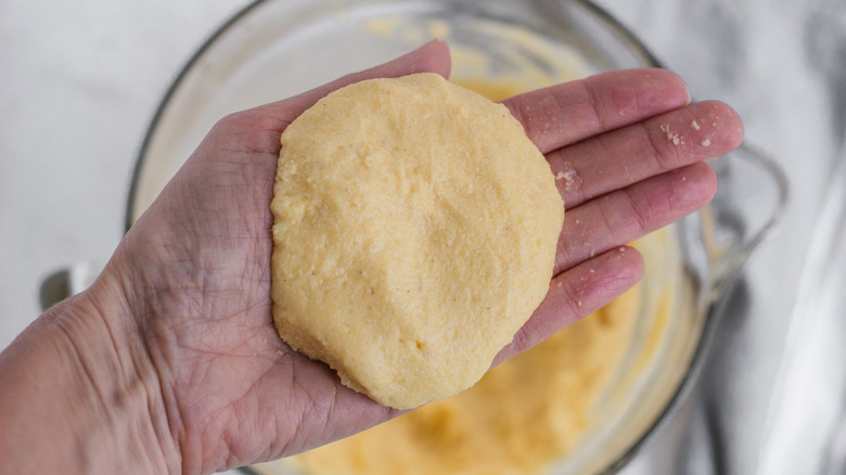 arepas dough in hand 