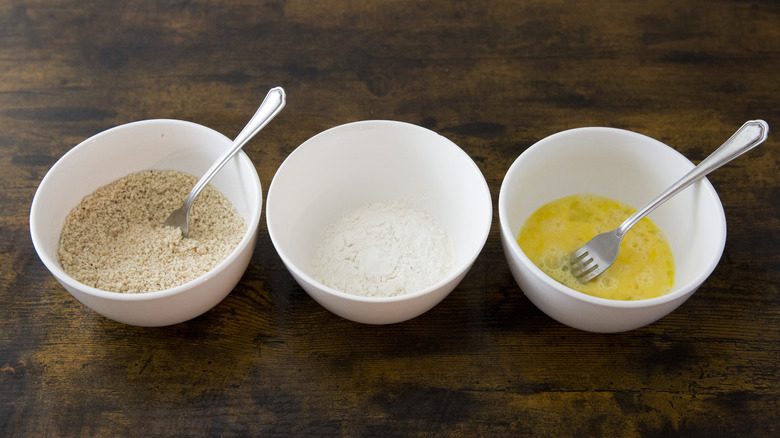 3 breading bowls on table