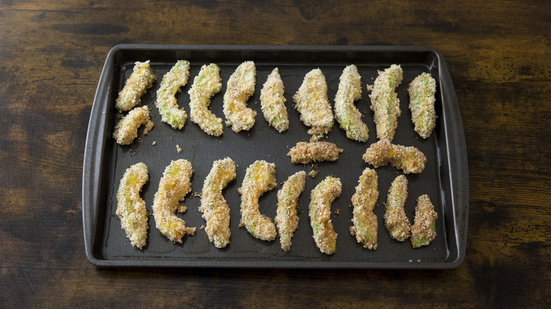 unbaked avocado fries in pan 