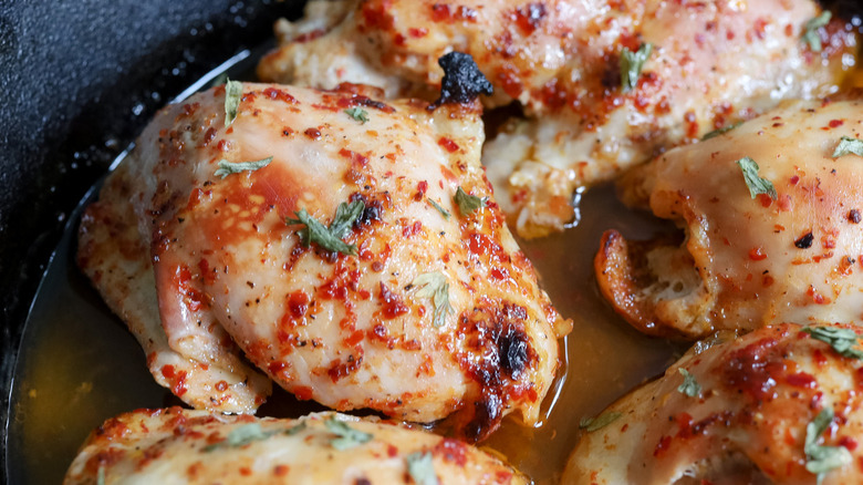 cooked chicken thighs in pan