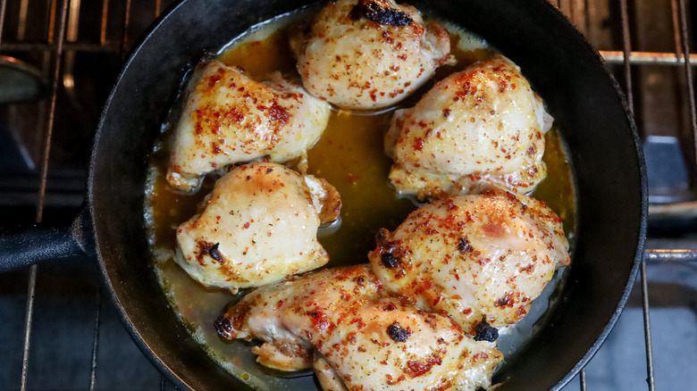 cooked chicken thighs in pan