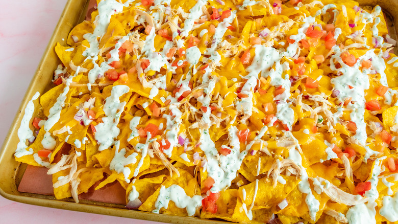 nachos with drizzled sour cream