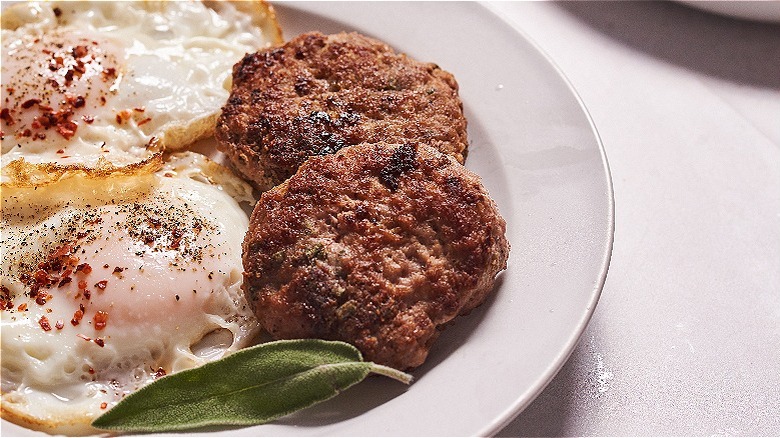 turkey sausages on a plate with eggs