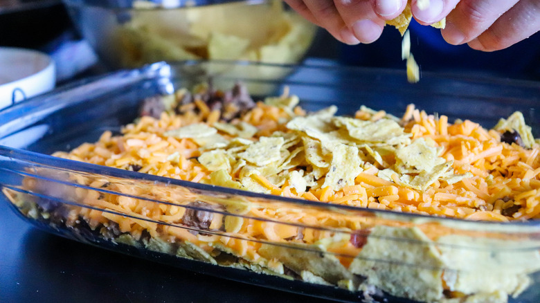 crushing tortilla chips for taco bake