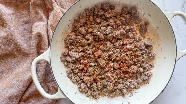 ground beef in pan with spices