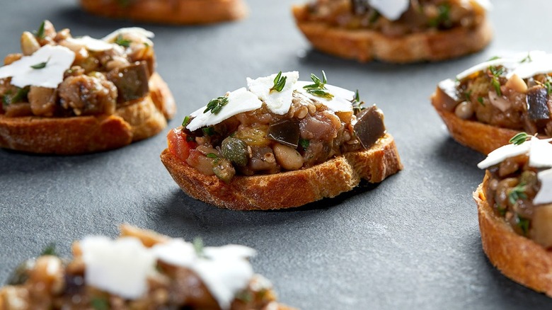 eggplant crostinis with cheese on top