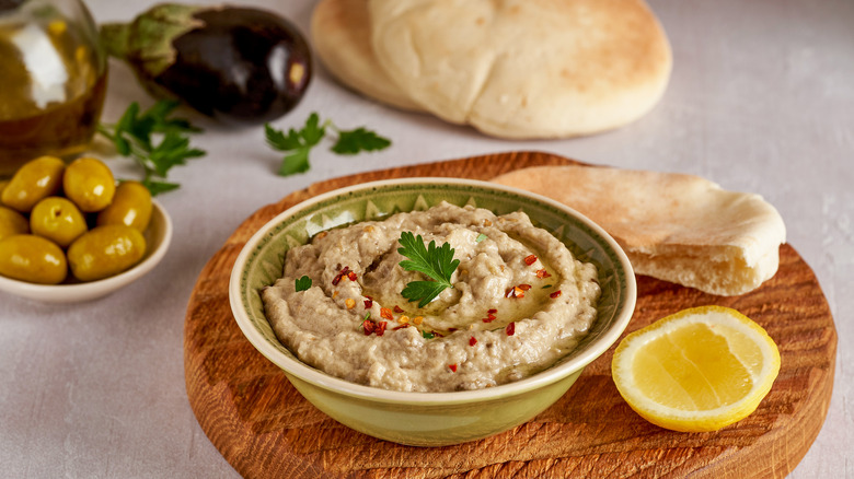 baba ganoush on wooden platter