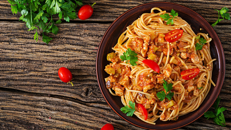 spaghetti with eggplant on wooden table