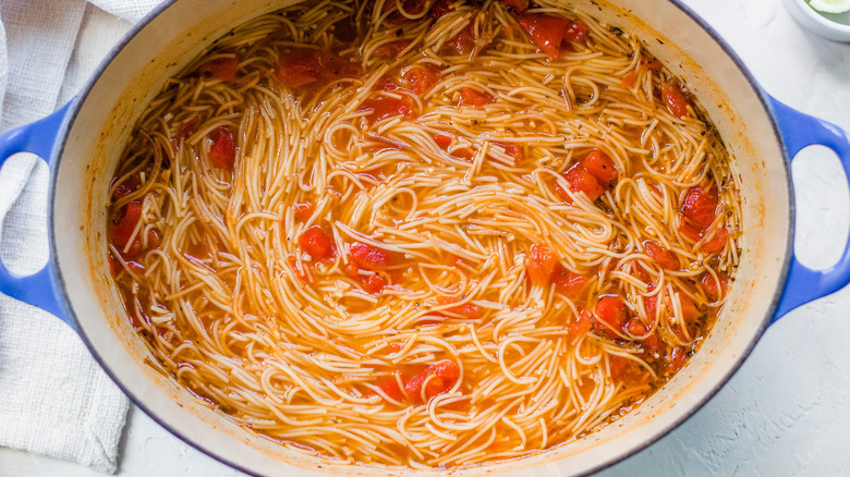 pasta and tomatoes in pot