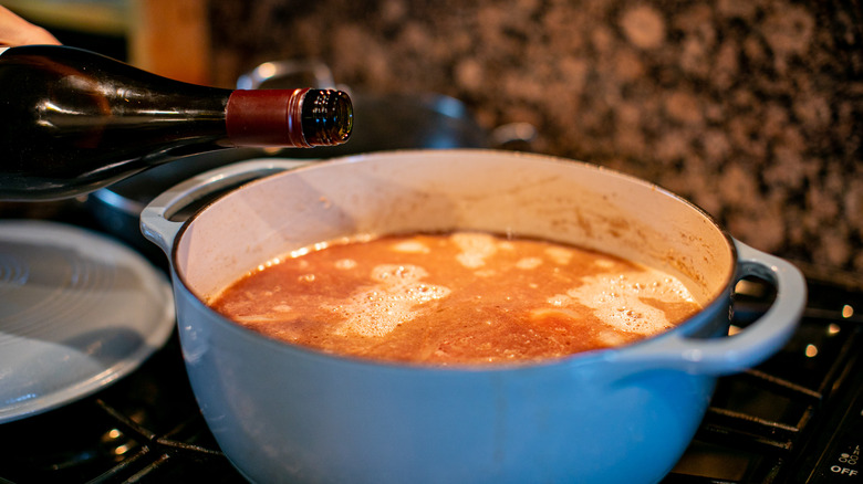 adding wine to soup