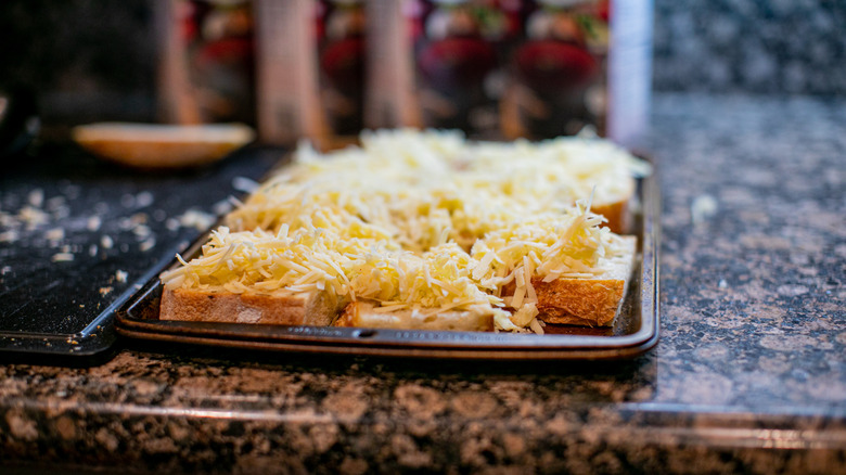 pan of bread topped with cheese