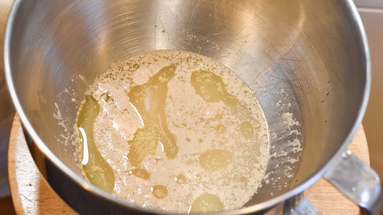 water and yeast in mixing bowl