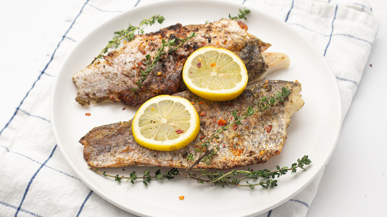 grilled barramundi on plate