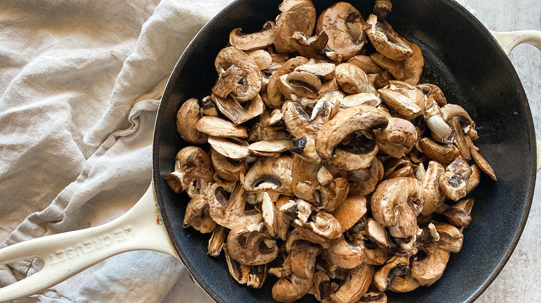 sautéing mushrooms in skillet