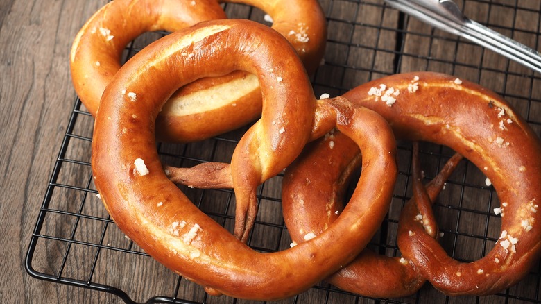 Soft pretzels on a rack with salt