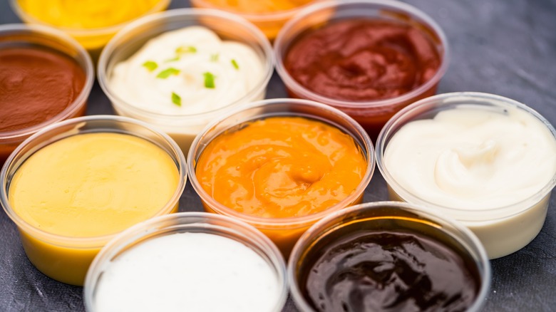 containers of different sauces and condiments