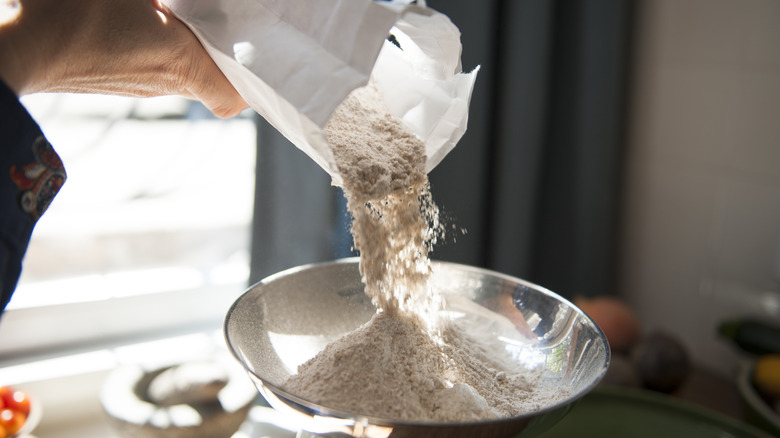 pouring flour into bowl