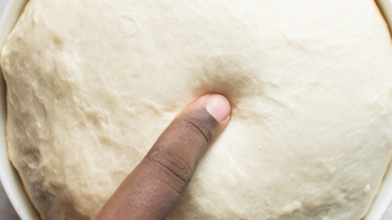 poking proofed dough