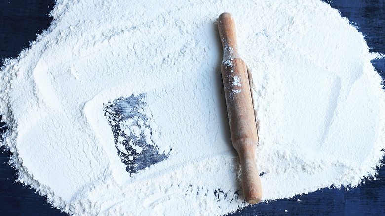 flour on counter with rolling pin