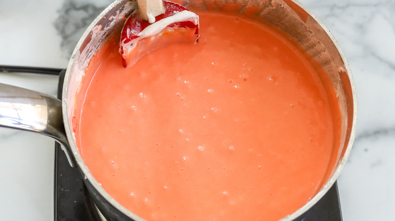 orange fudge mixture in saucepan
