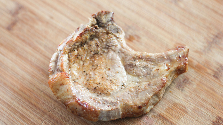 pork chop on cutting board