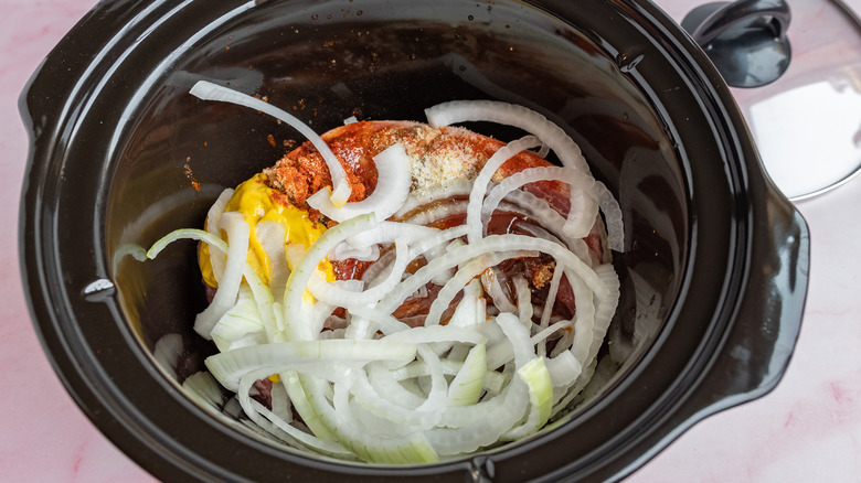 pork butt and onions in a crock pot