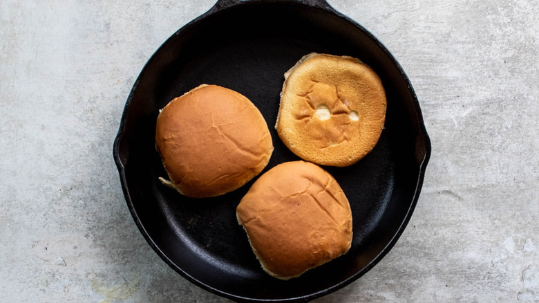 buns toasting on skillet