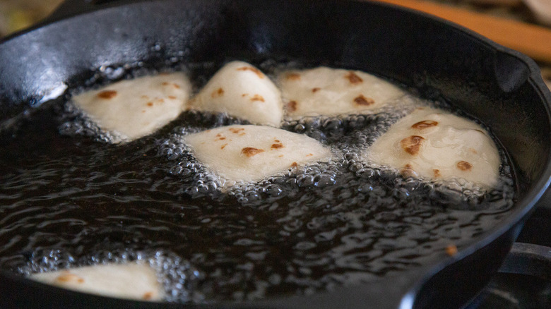 tortilla pieces frying in oil