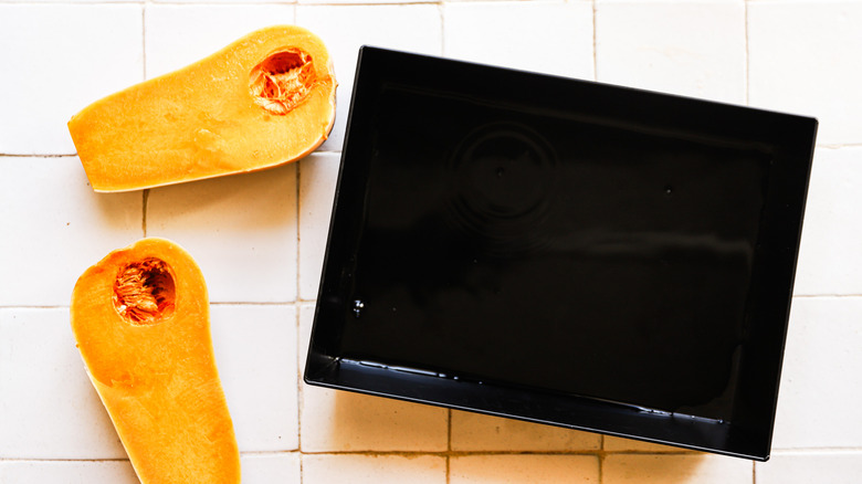 Halved squash with baking dish