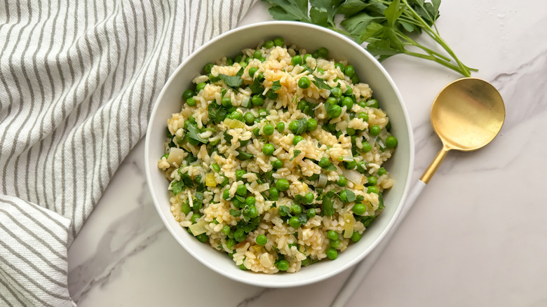 risi e bisi rice and peas in white bowl