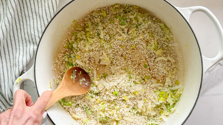 stirring ingredients in pot