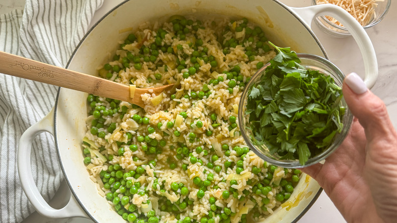 adding parsley to pot