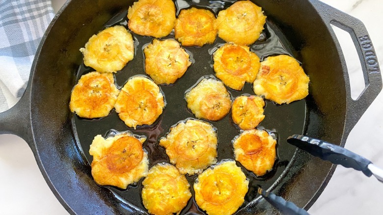 smashed plantains in cast iron skillet