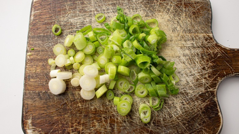 chopped scallions on cutting board