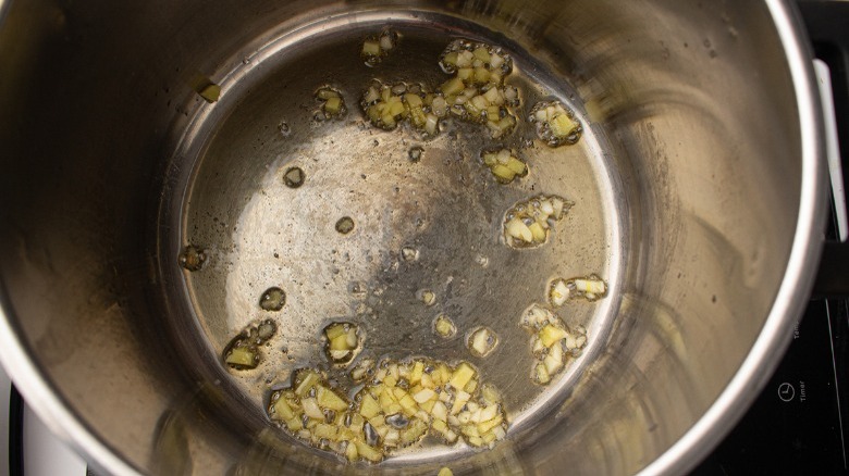 ginger and garlic cooking in pot