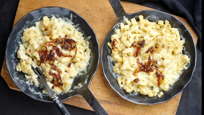 cheesy noodle in metal dishes